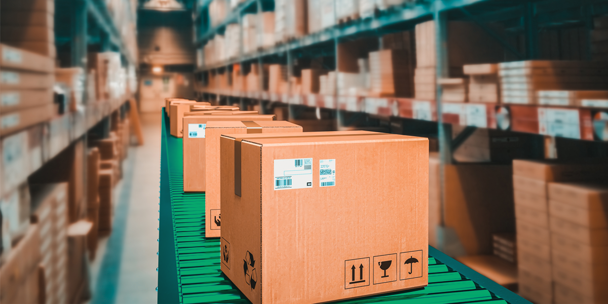 boxes on a conveyor belt running through a warehouse