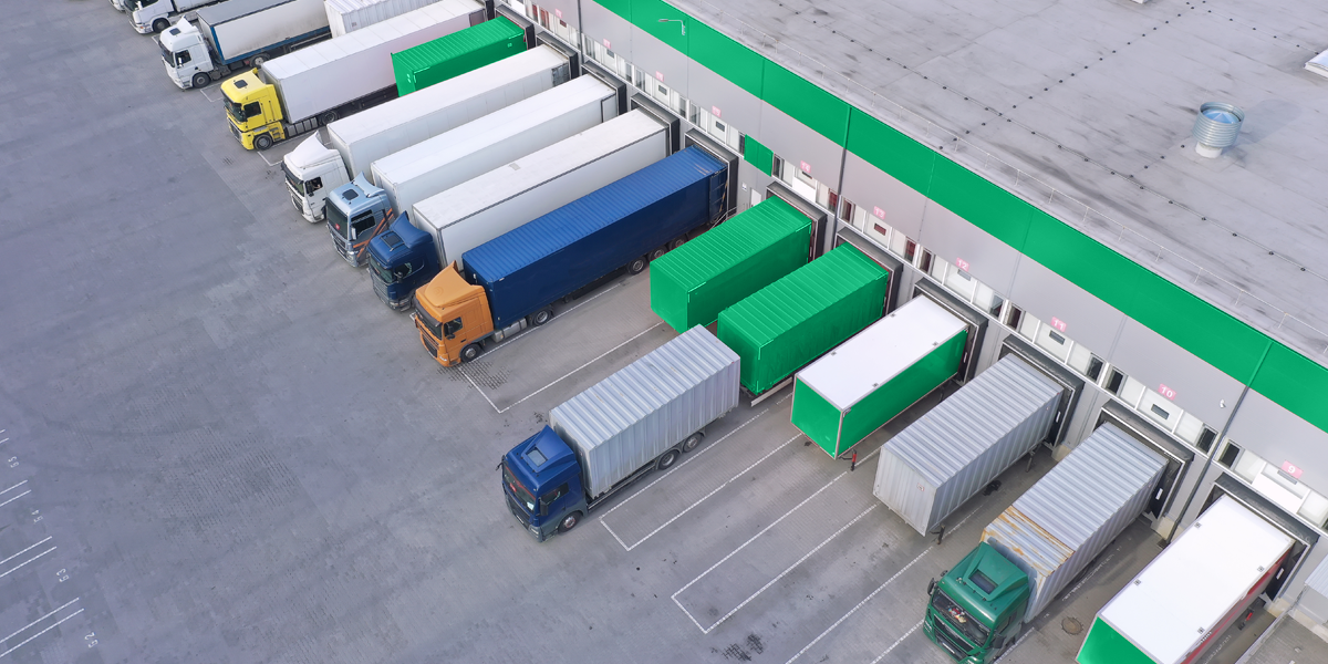 semi trucks lined up at logistics center