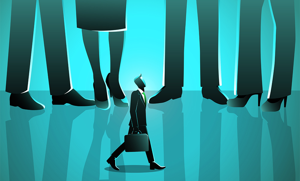 An illustration of a small businessman standing under giant business people